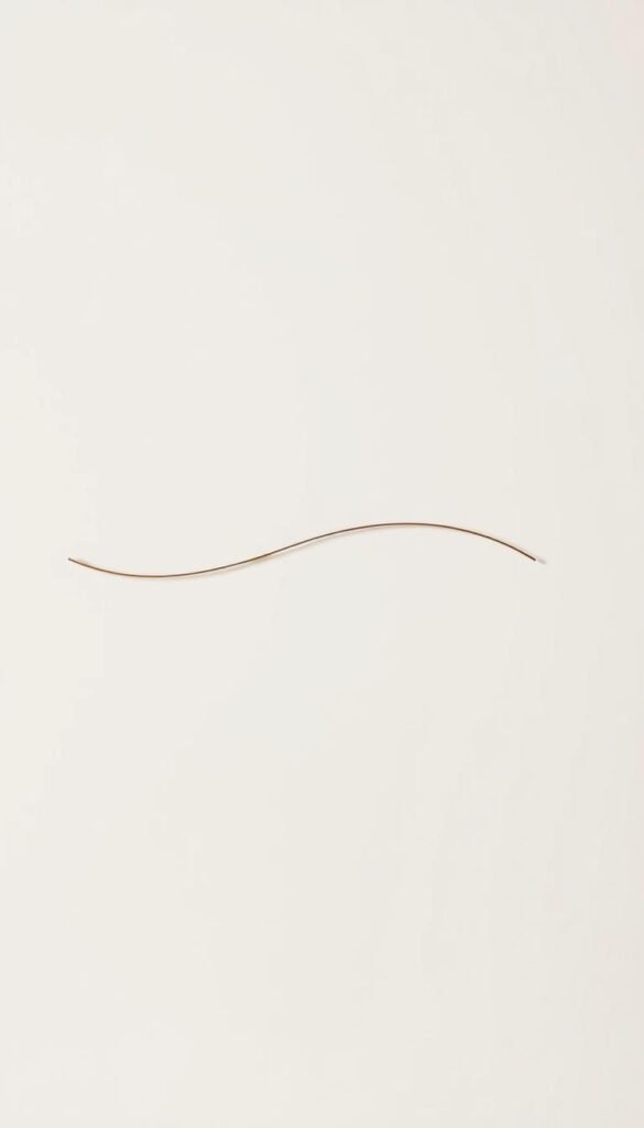 A serene, minimalist wall art design featuring a single, elegantly curved line in a soothing, muted color palette. The line, rendered in a soft, matte finish, is the focal point, set against a clean, white background that exudes a sense of tranquility. The composition is thoughtfully balanced, with the line's gentle undulation creating a calming, meditative effect. Soft, diffused lighting casts a warm, natural glow, adding depth and dimension to the artwork. The overall aesthetic evokes the principles of Japandi design, where simplicity, functionality, and a connection to nature harmonize to create a peaceful, harmonious living space.