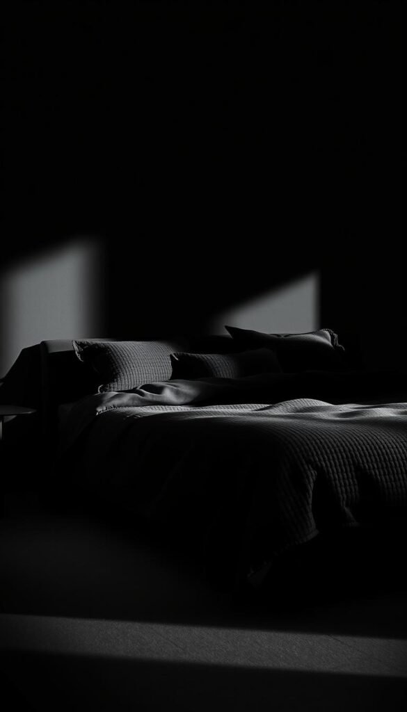 A luxurious all-black bed, its textured duvet and pillows exuding a sense of refined elegance. Dramatic chiaroscuro lighting casts deep shadows, creating an enveloping, moody atmosphere. The bedframe's sleek silhouette is accentuated by the interplay of light and dark, while the plush, inviting bedding beckons the viewer to sink into its cozy embrace. Subtle tonal variations in the fabrics add depth and visual interest, elevating the minimalist aesthetic. This commanding, statement-making centerpiece anchors the room, evoking a sophisticated, earthy vibe that commands attention.